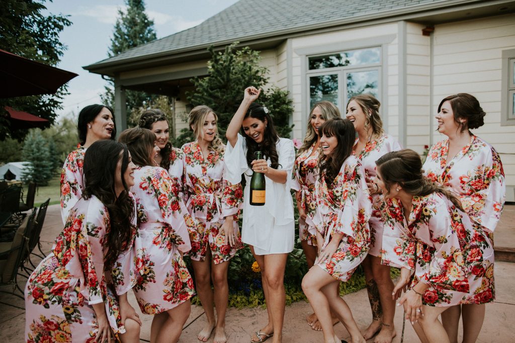 Tasha wedding with bridesmaids and champange